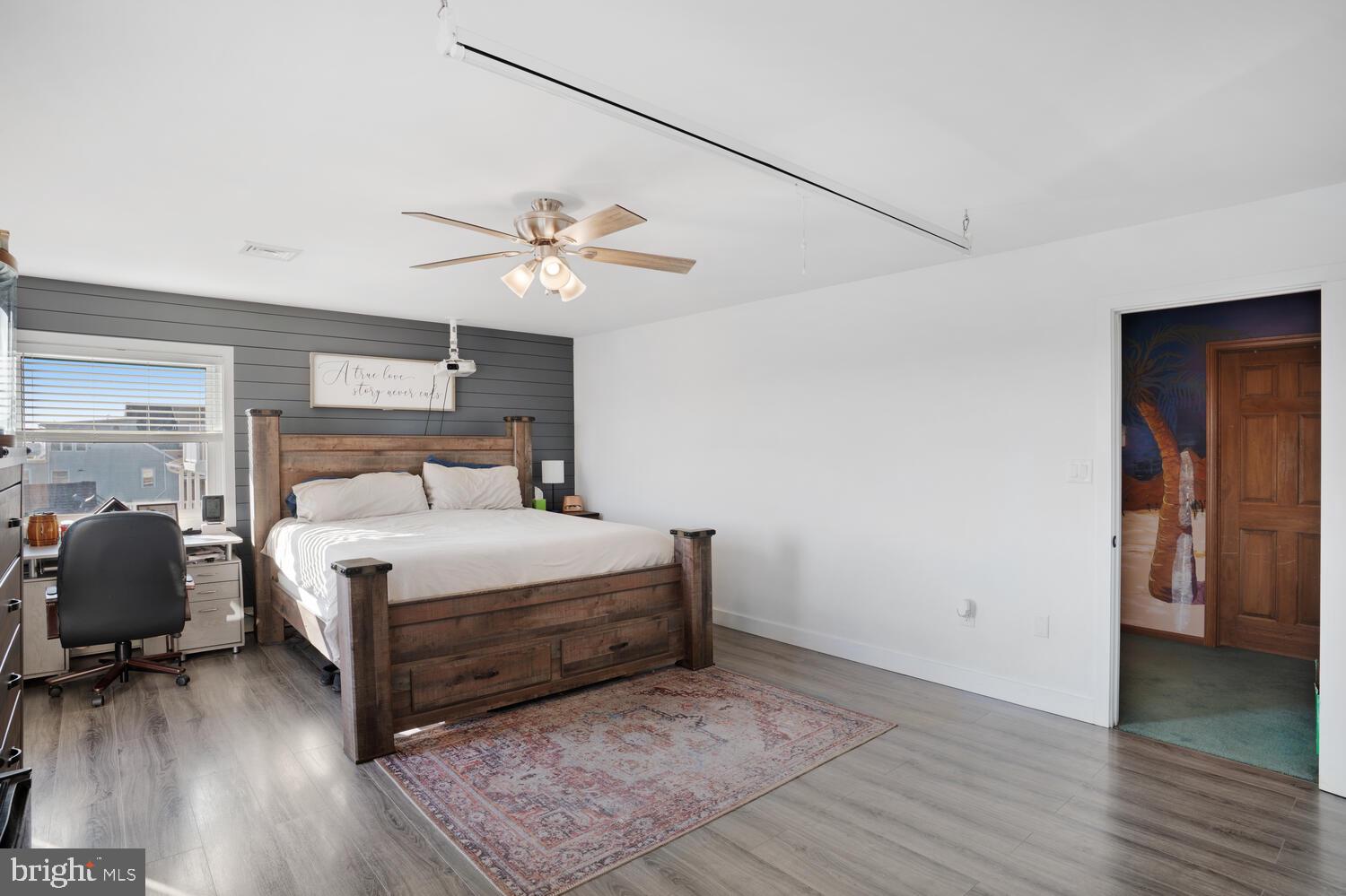 322 Dock Road West Creek, NJ 08092 - Photo 45 of 49 a bedroom with a bed and a chandelier