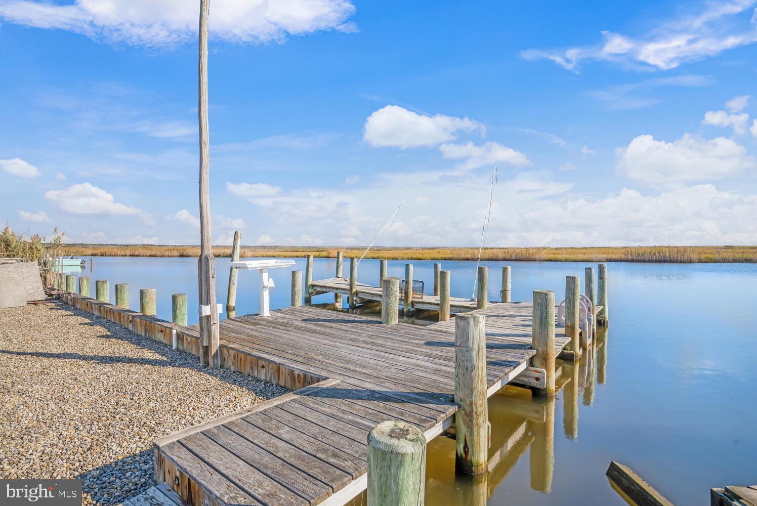 322 Dock Road West Creek, NJ 08092 - Photo 8 of 49 a balcony with wooden floor table and chairs