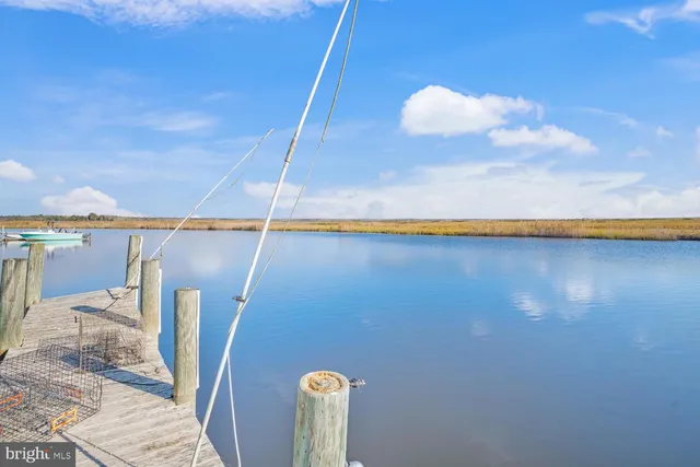 a roof deck with a table and chairs