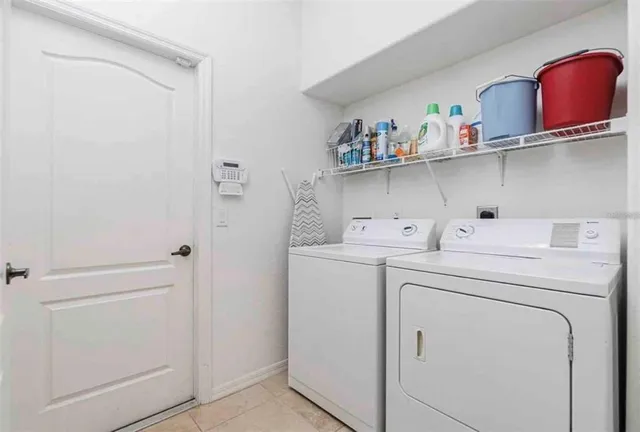 a utility room with dryer and washer
