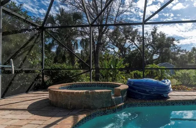 a view of a backyard with sitting area