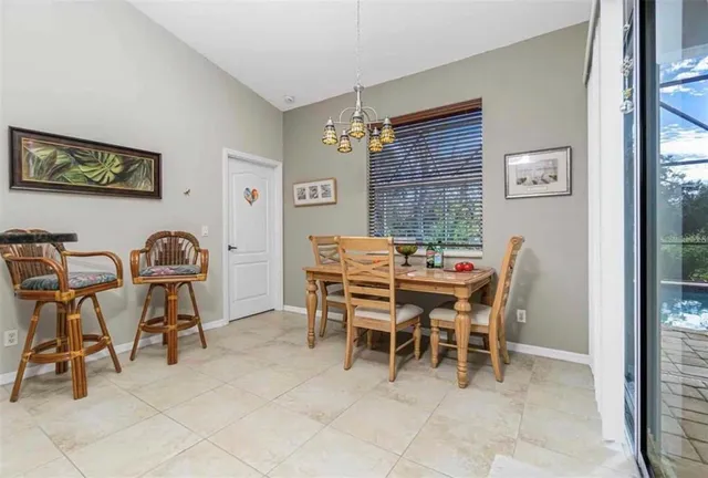 a dining room with furniture and window