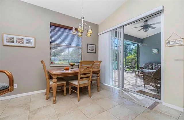 a dining room with furniture and window