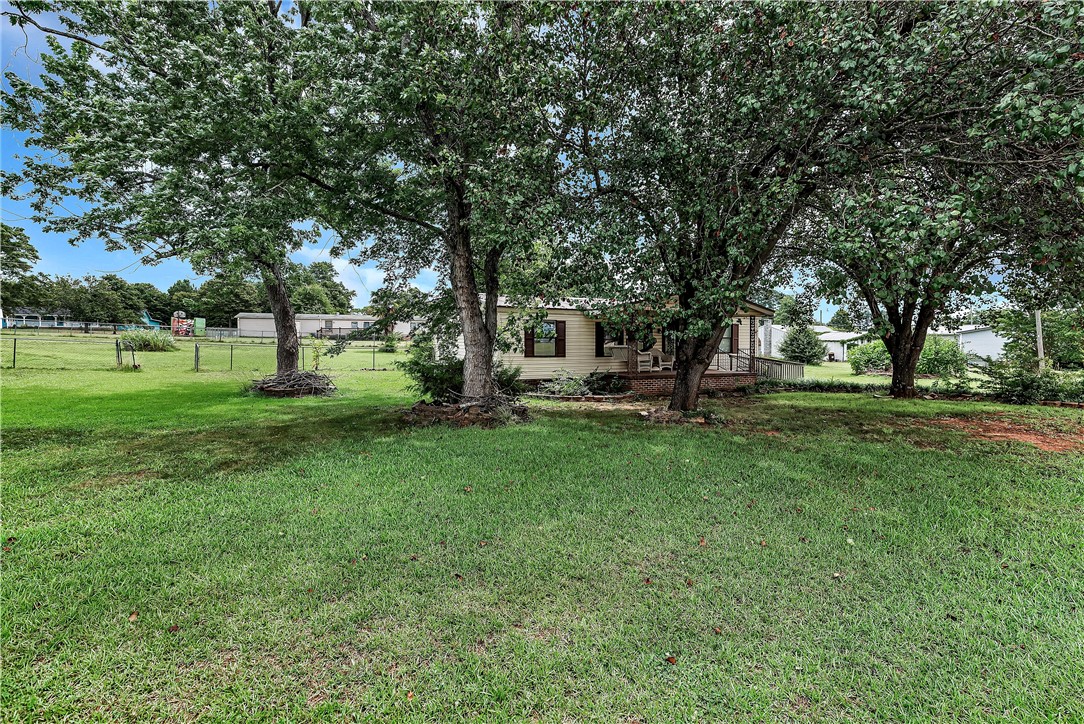 1004 Wiles Road Anderson, SC 29625 - Photo 26 of 26 Mature trees shade this charming home, offering a serene, private retreat.