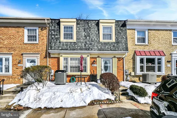 a view of a livingroom with furniture and a large window