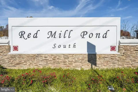 a street sign on a brick wall