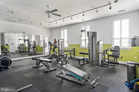 an aerial view of a house with a yard basket ball court and outdoor seating