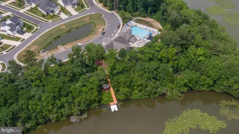 an aerial view of a house with lake view