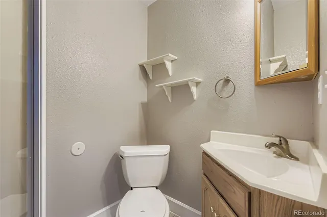 a view of a house with a yard and deck