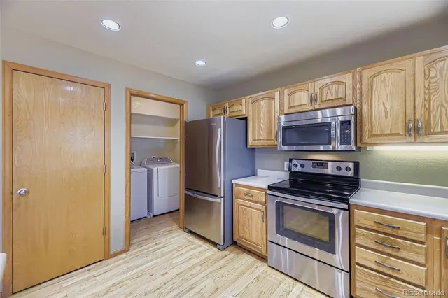 a kitchen with a refrigerator stove and microwave