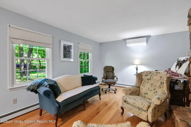 a living room with furniture and a window
