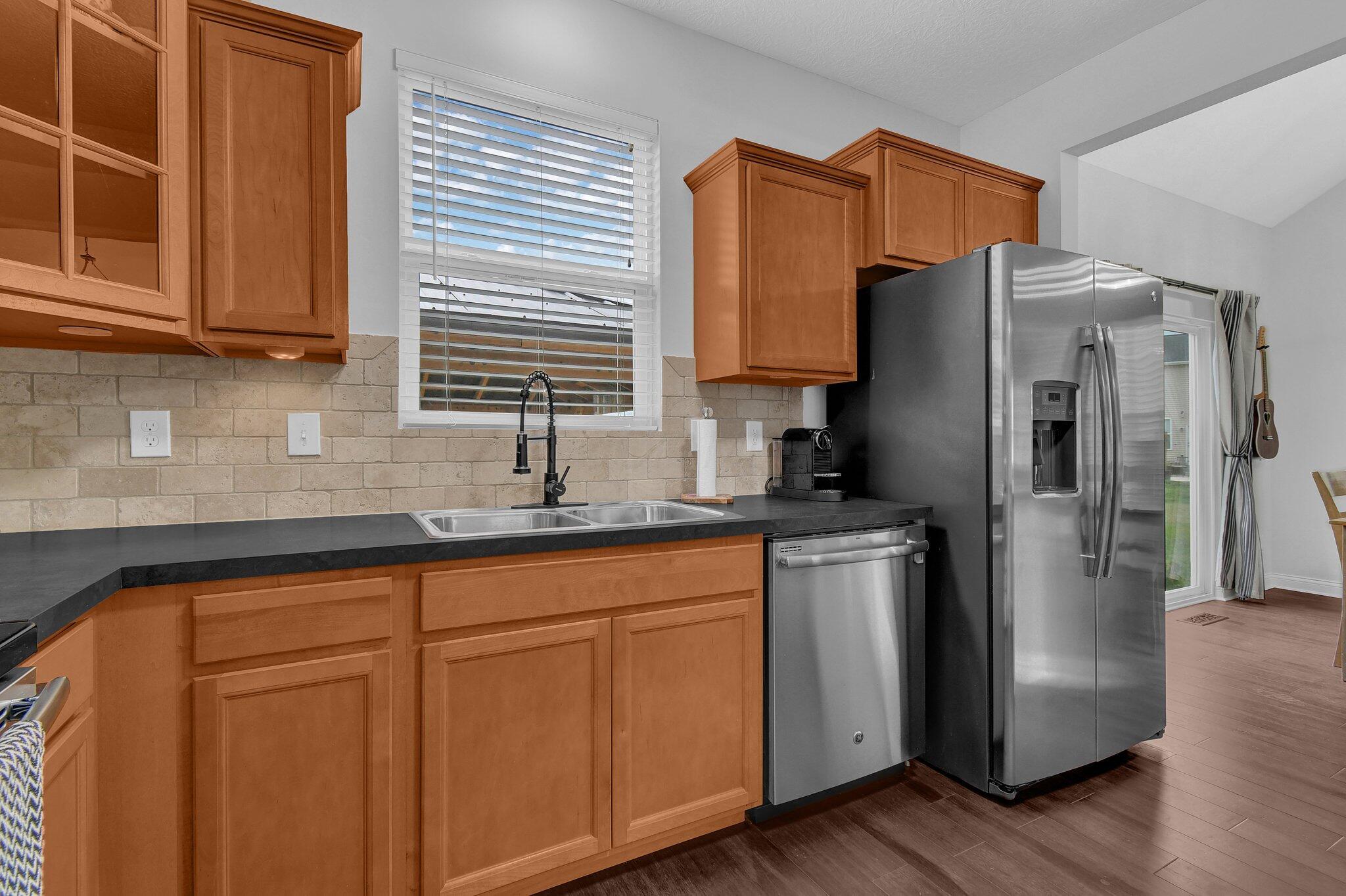 916 Rooks Circle Sunbury, OH 43074 - Photo 12 of 39 Kitchen pantry, stainless steel appliances, neutral counters, and an upgraded backsplash!