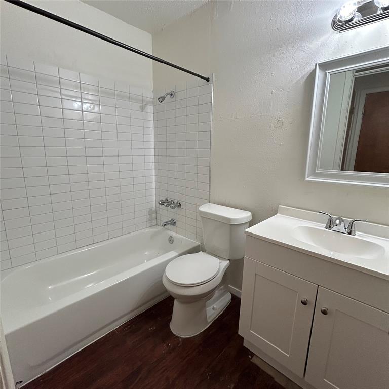 1011 West 23rd Street, Unit 102 Austin, TX 78705 - Photo 6 of 10 a bathroom with a sink toilet and shower