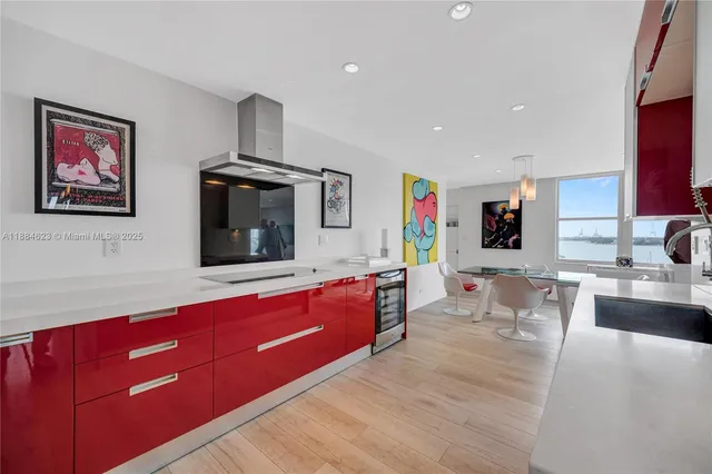 a kitchen with stainless steel appliances granite countertop a sink wooden cabinets and granite counter tops