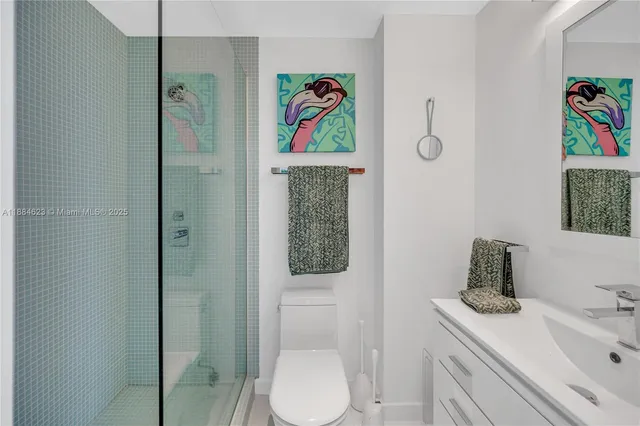 a bathroom with a sink a toilet and vanity