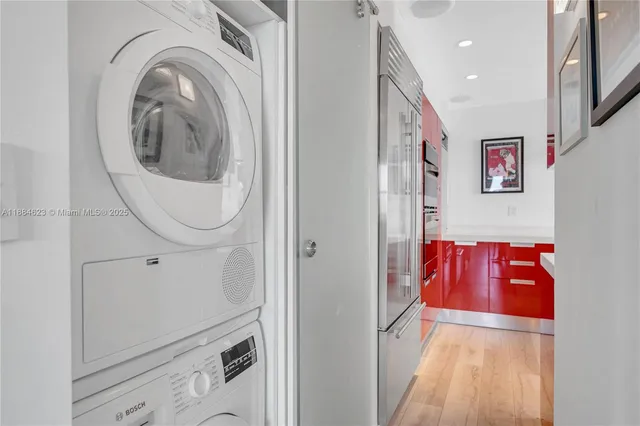 a view of a hallway with washer and dryer