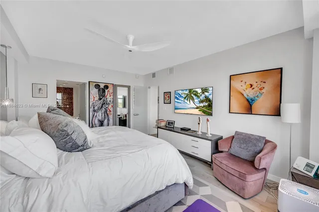 a bedroom with a bed and a couch