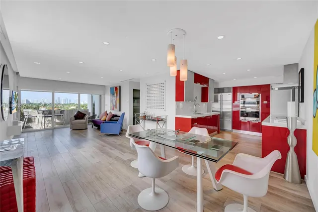 a living room with furniture and kitchen view