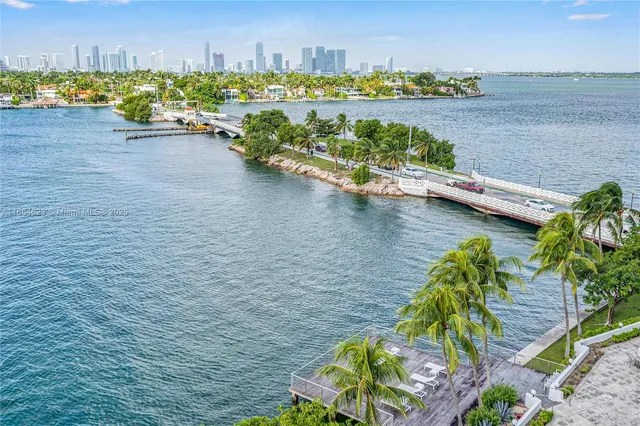 an aerial view of a house with a lake view