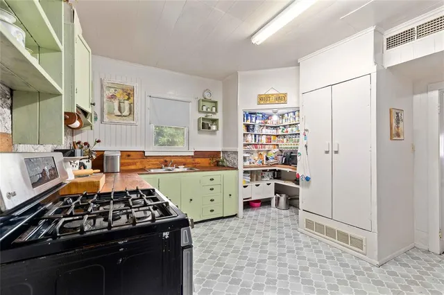 a kitchen with stainless steel appliances a stove and a refrigerator