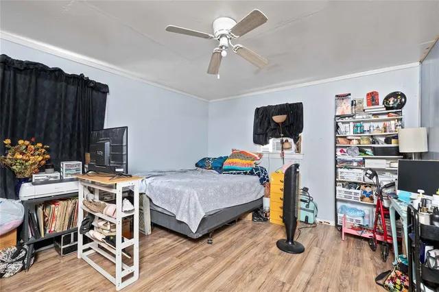 a bedroom that has a bed and a bookshelf in it