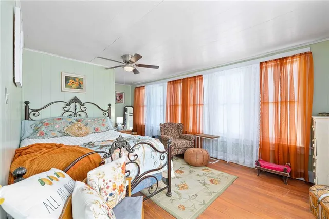 a bedroom with a bed and window