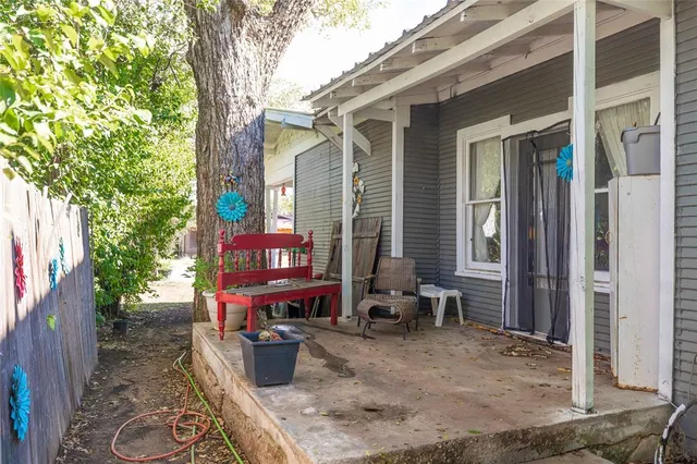 a view of a chairs and table in the house