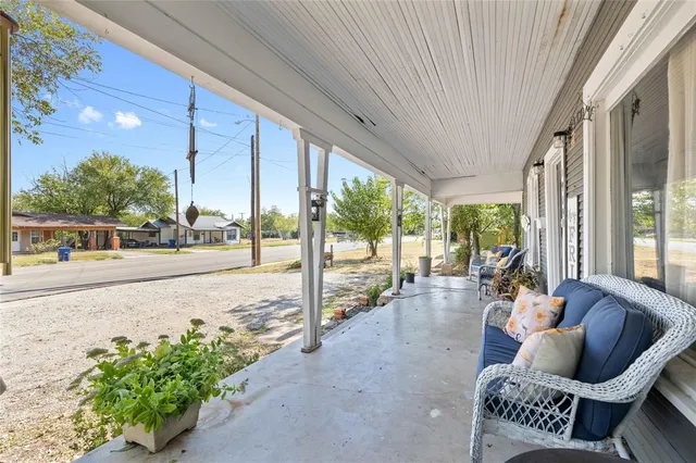 a view of a patio with couple of chairs in patio