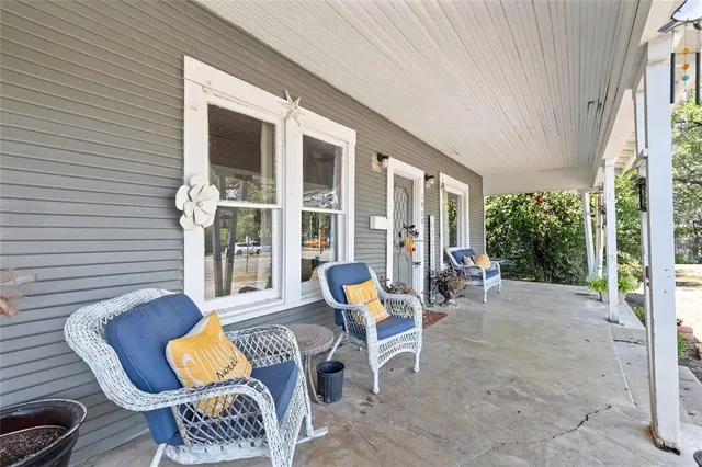 a view of a chairs and table in patio