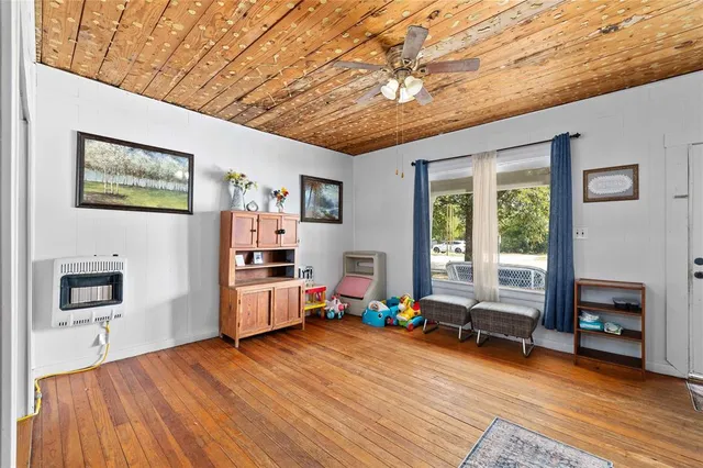 a room with furniture and a wooden floor