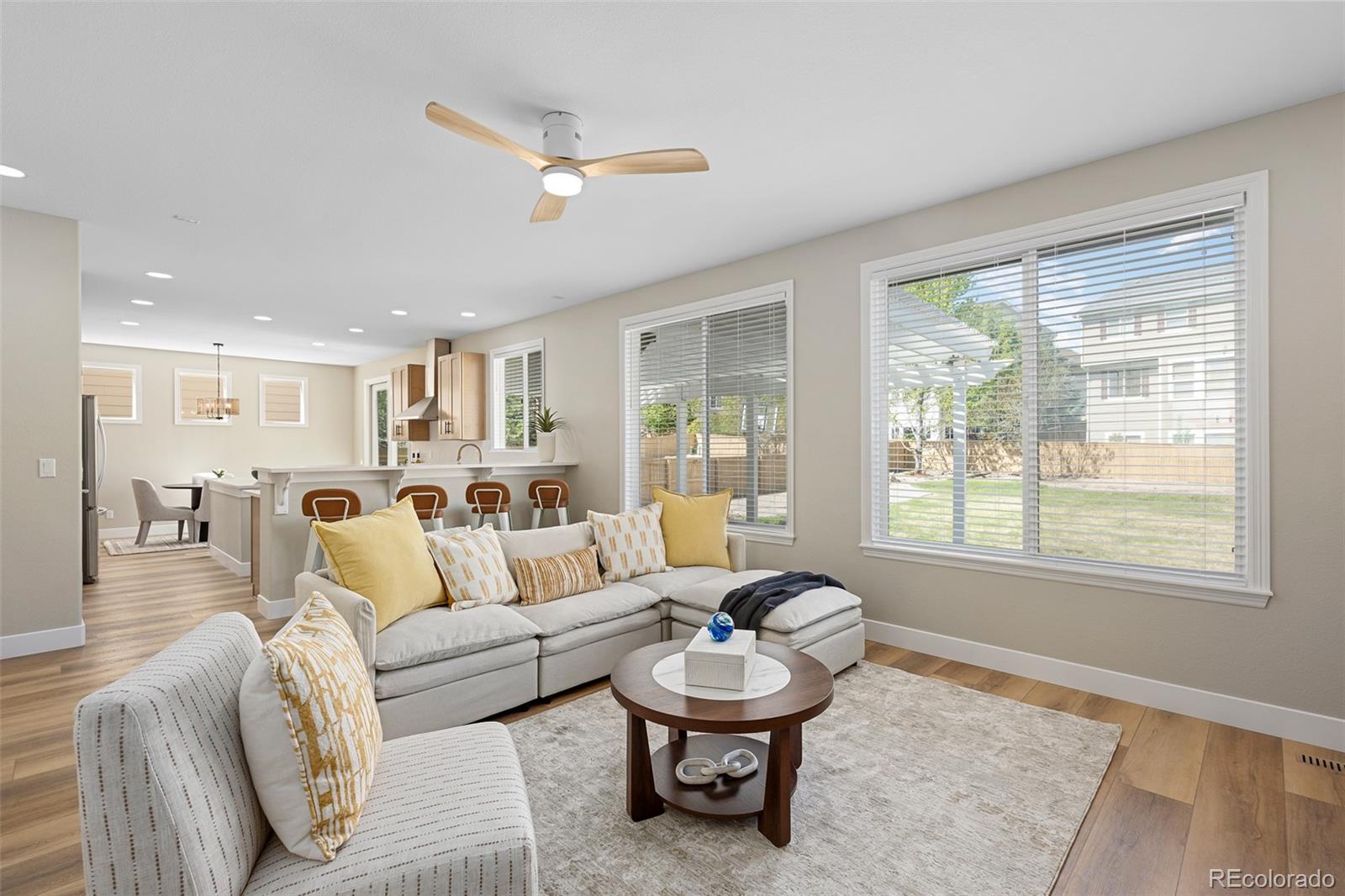 11036 Glengate Circle Highlands Ranch, CO 80130 - Photo 11 of 42 a living room with furniture and a window