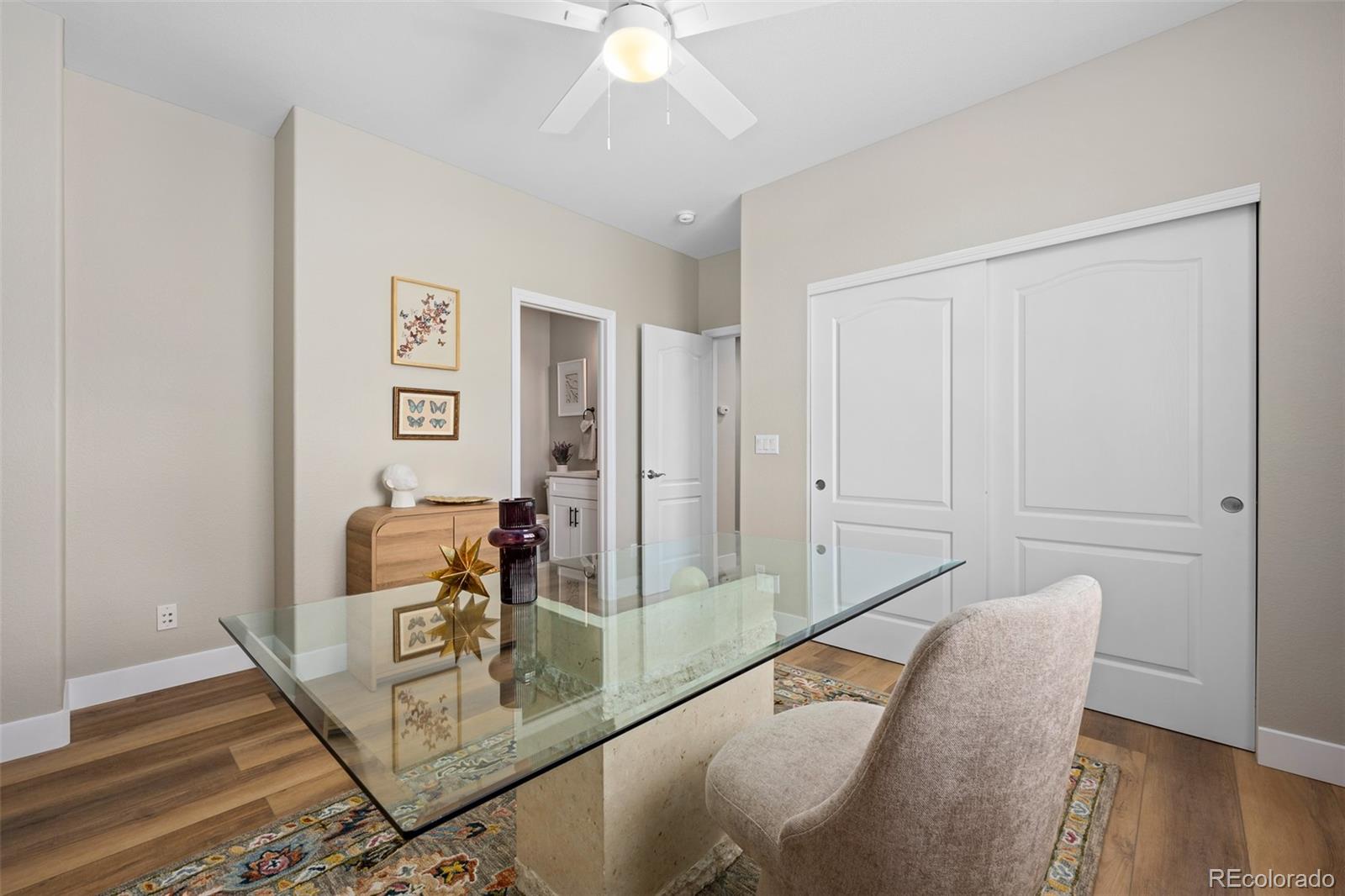 11036 Glengate Circle Highlands Ranch, CO 80130 - Photo 13 of 42 a dining room with furniture and wooden floor