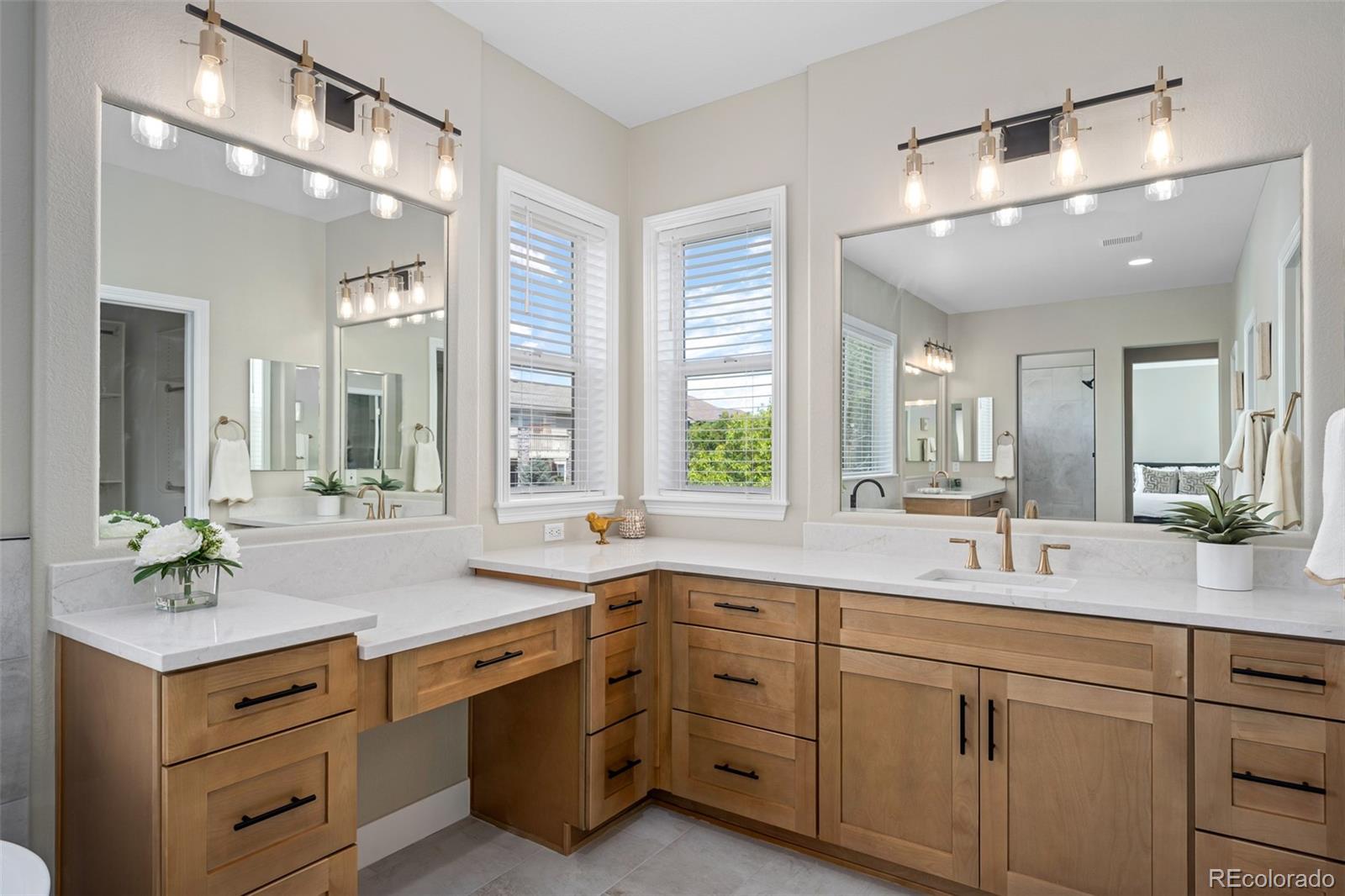 11036 Glengate Circle Highlands Ranch, CO 80130 - Photo 21 of 42 a bathroom with a sink double vanity and a mirror