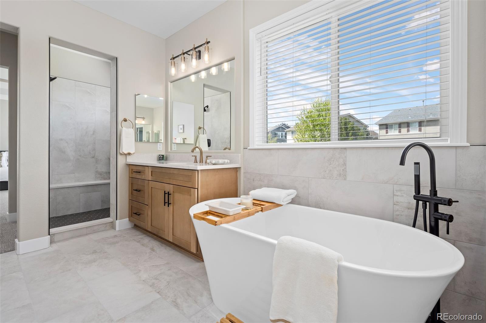 11036 Glengate Circle Highlands Ranch, CO 80130 - Photo 22 of 42 a bathroom with a sink and a bathtub