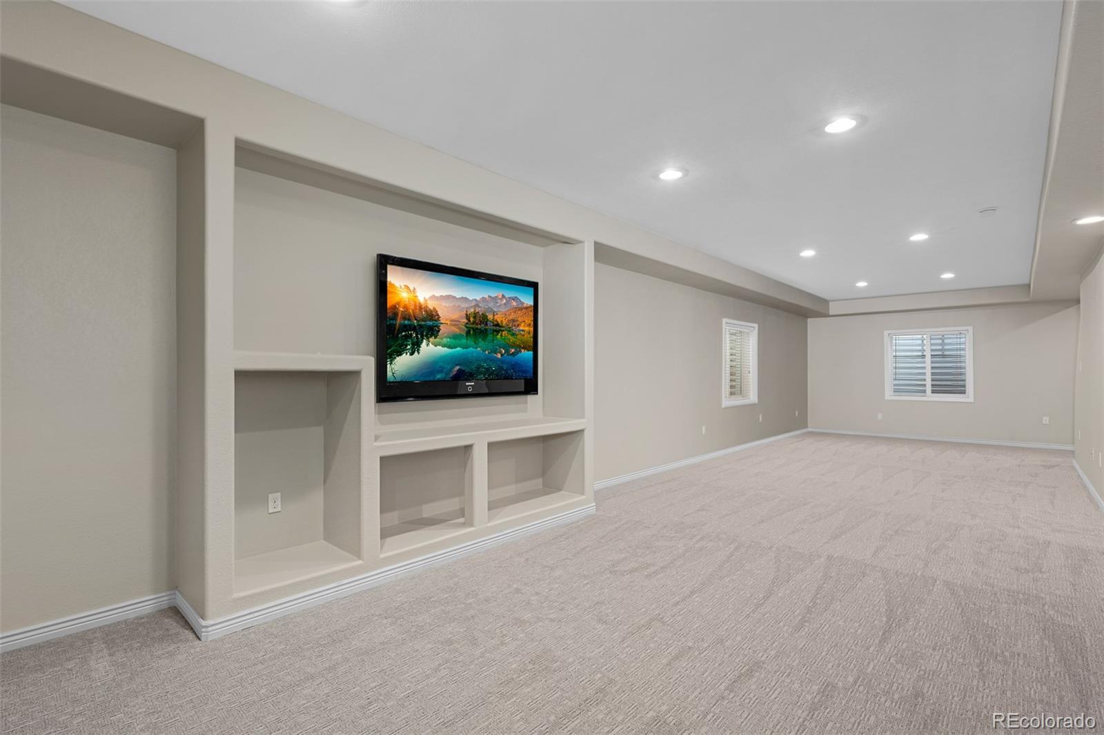 11036 Glengate Circle Highlands Ranch, CO 80130 - Photo 28 of 42 a view of a livingroom with a flat screen tv
