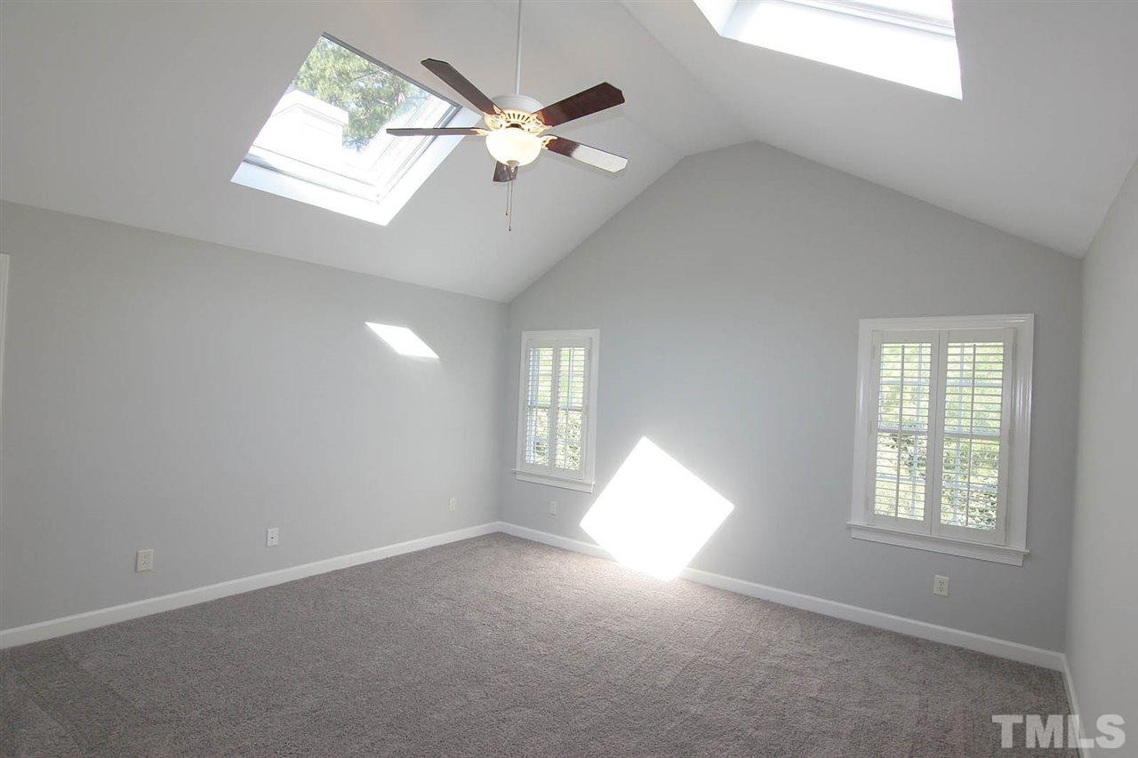 4210 Norman Ridge Lane Raleigh, NC 27613 - Photo 17 of 25 Plantation shutters and a walk in closet.
