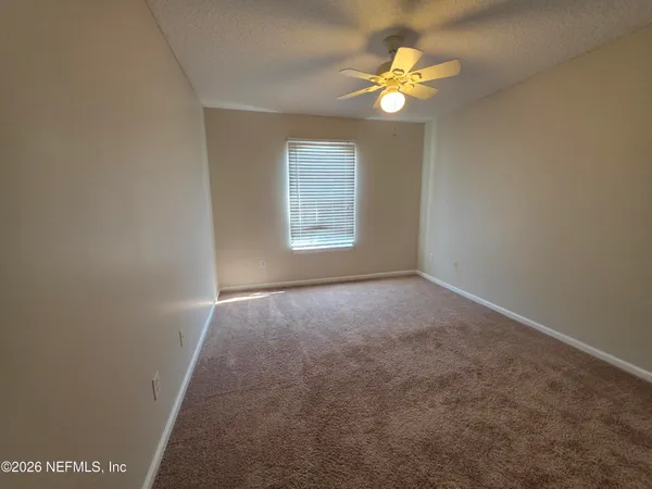a spacious bathroom with a double vanity sink a mirror and a shower