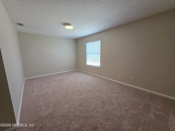 a bathroom with a toilet and a bathtub