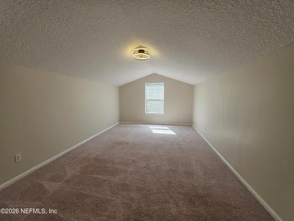 a view of a house with backyard and porch