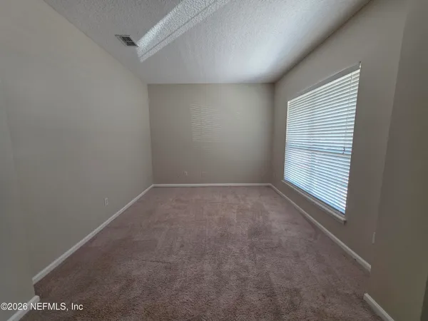 a kitchen with a refrigerator sink and cabinets