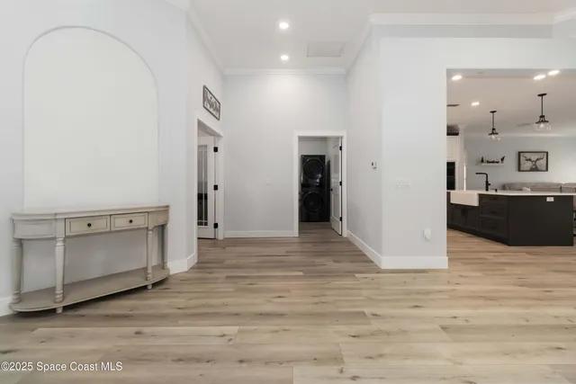 a view of kitchen and kitchen with stainless steel appliances