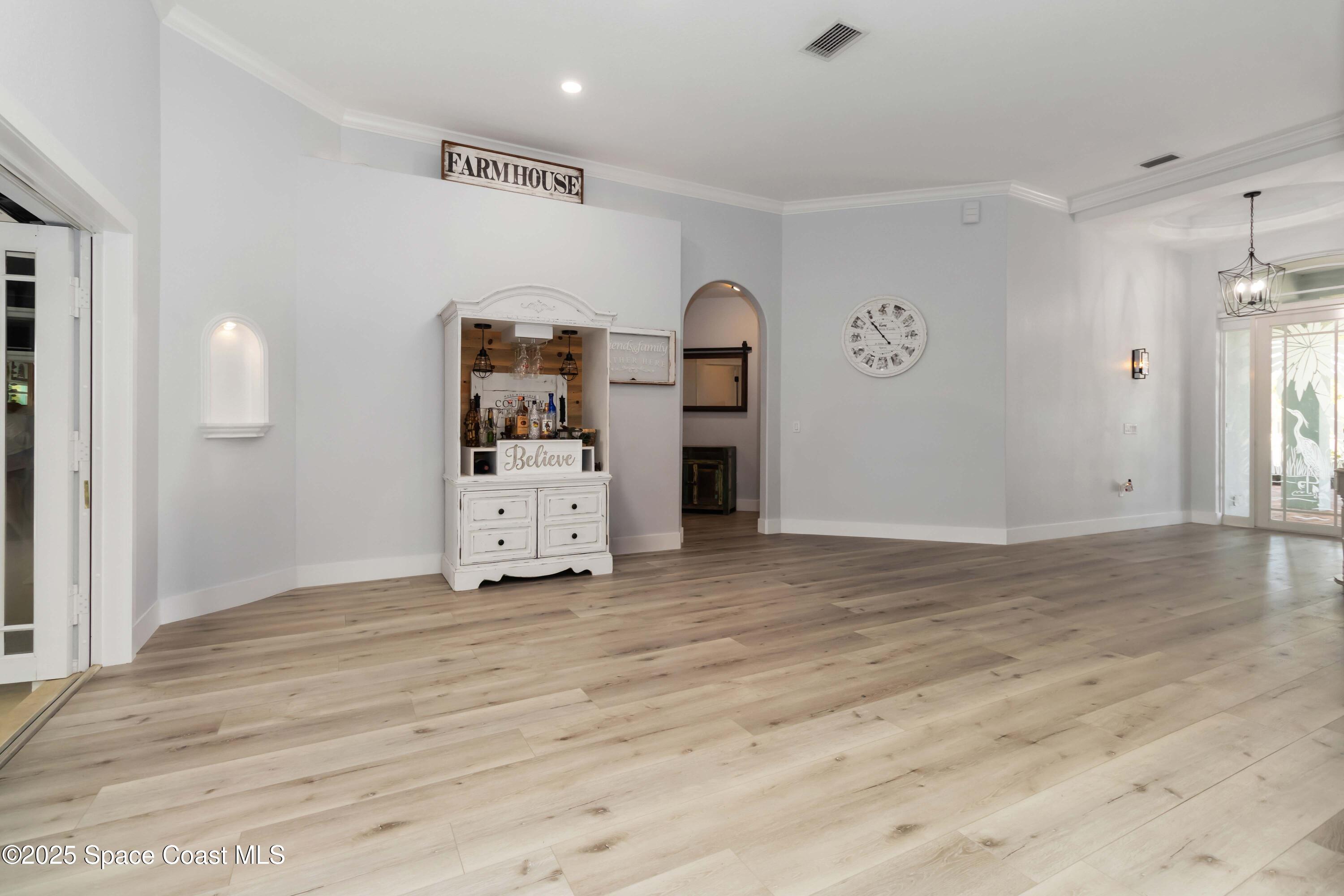 341 Buckskin Street Palm Bay, FL 32909 - Photo 16 of 69 a view of a livingroom with a workspace