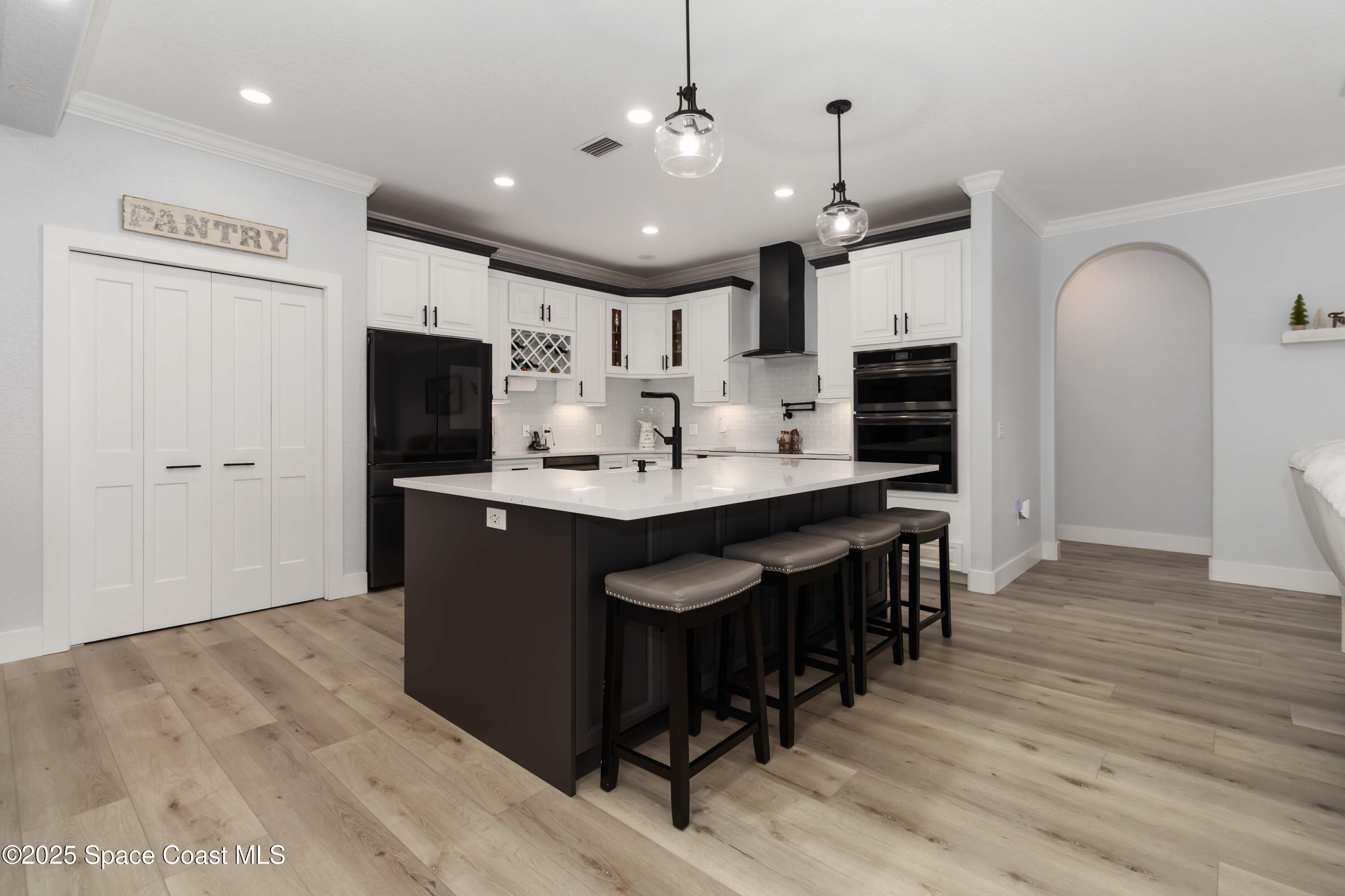341 Buckskin Street Palm Bay, FL 32909 - Photo 22 of 69 a kitchen with kitchen island granite countertop a sink appliances and cabinets
