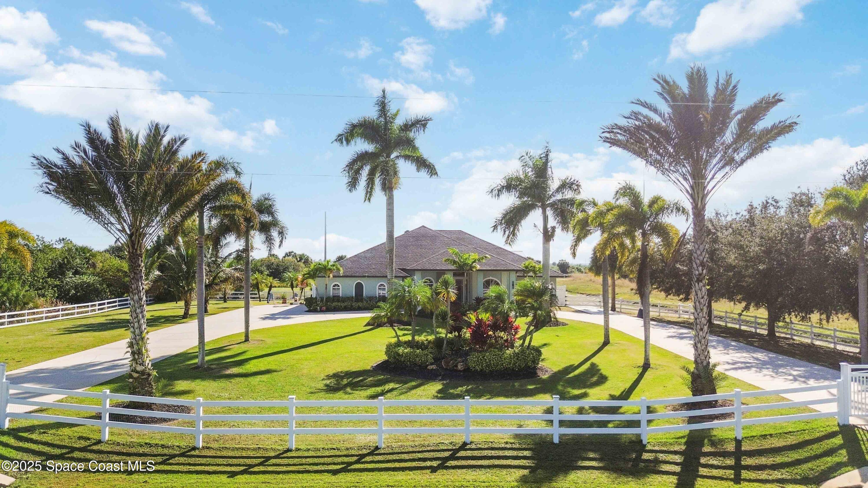 341 Buckskin Street Palm Bay, FL 32909 - Photo 3 of 69 a view of a swimming pool with a garden