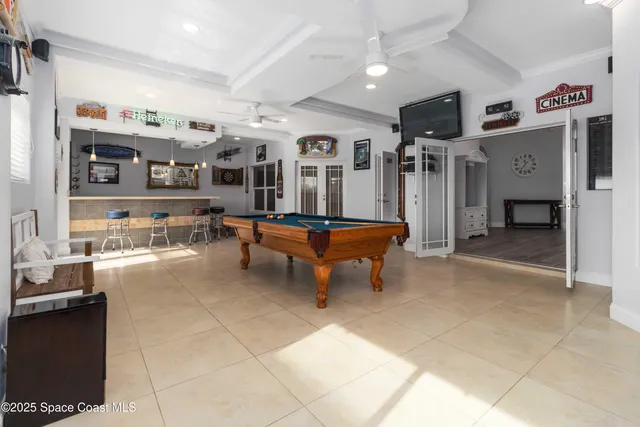 a bathroom with a granite countertop sink a mirror and shower