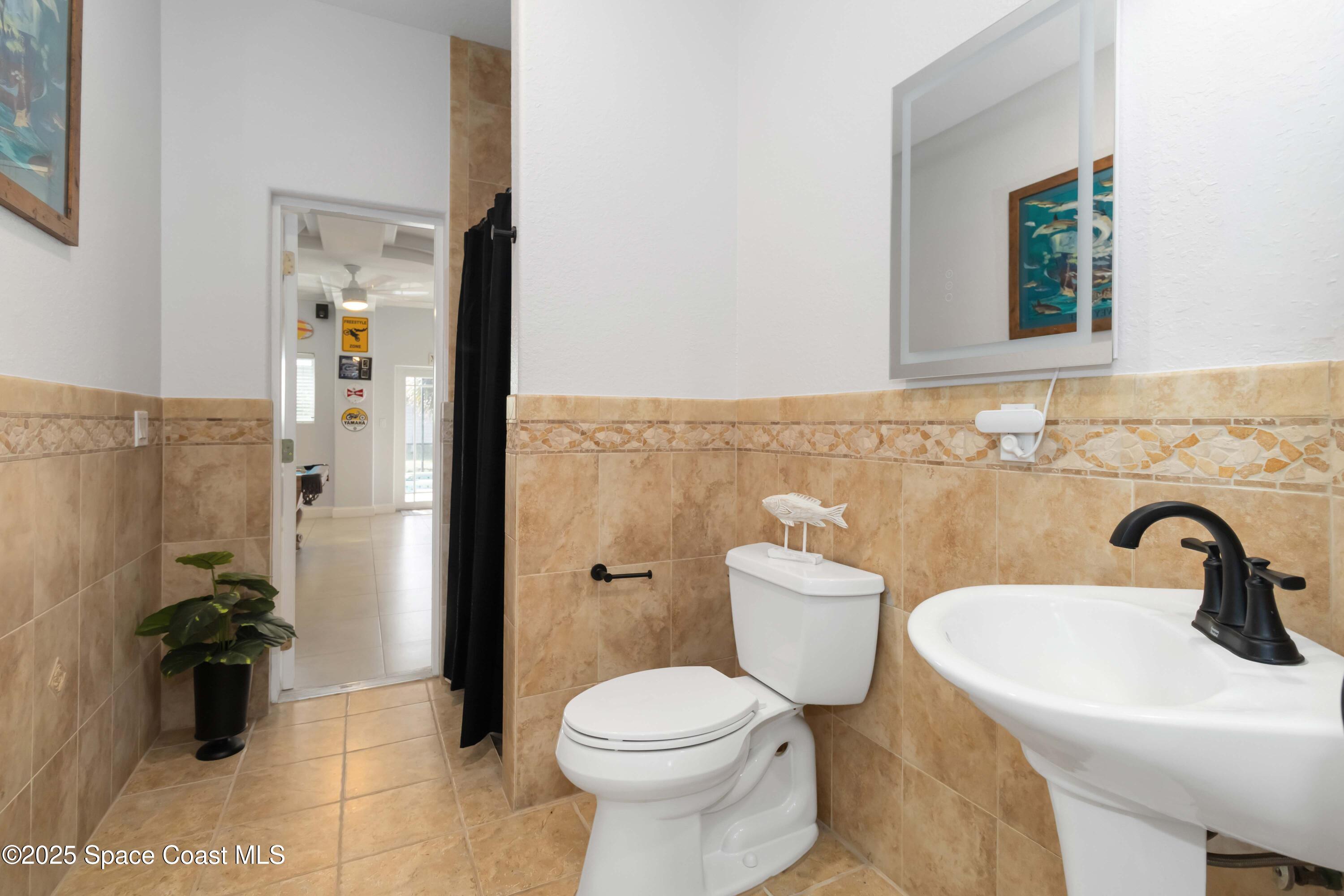 341 Buckskin Street Palm Bay, FL 32909 - Photo 34 of 69 a bathroom with a sink and a toilet