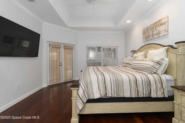 a bedroom with a large bed and a window