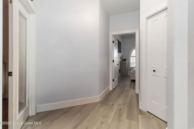 a view of a storage and utility room with washer and dryer