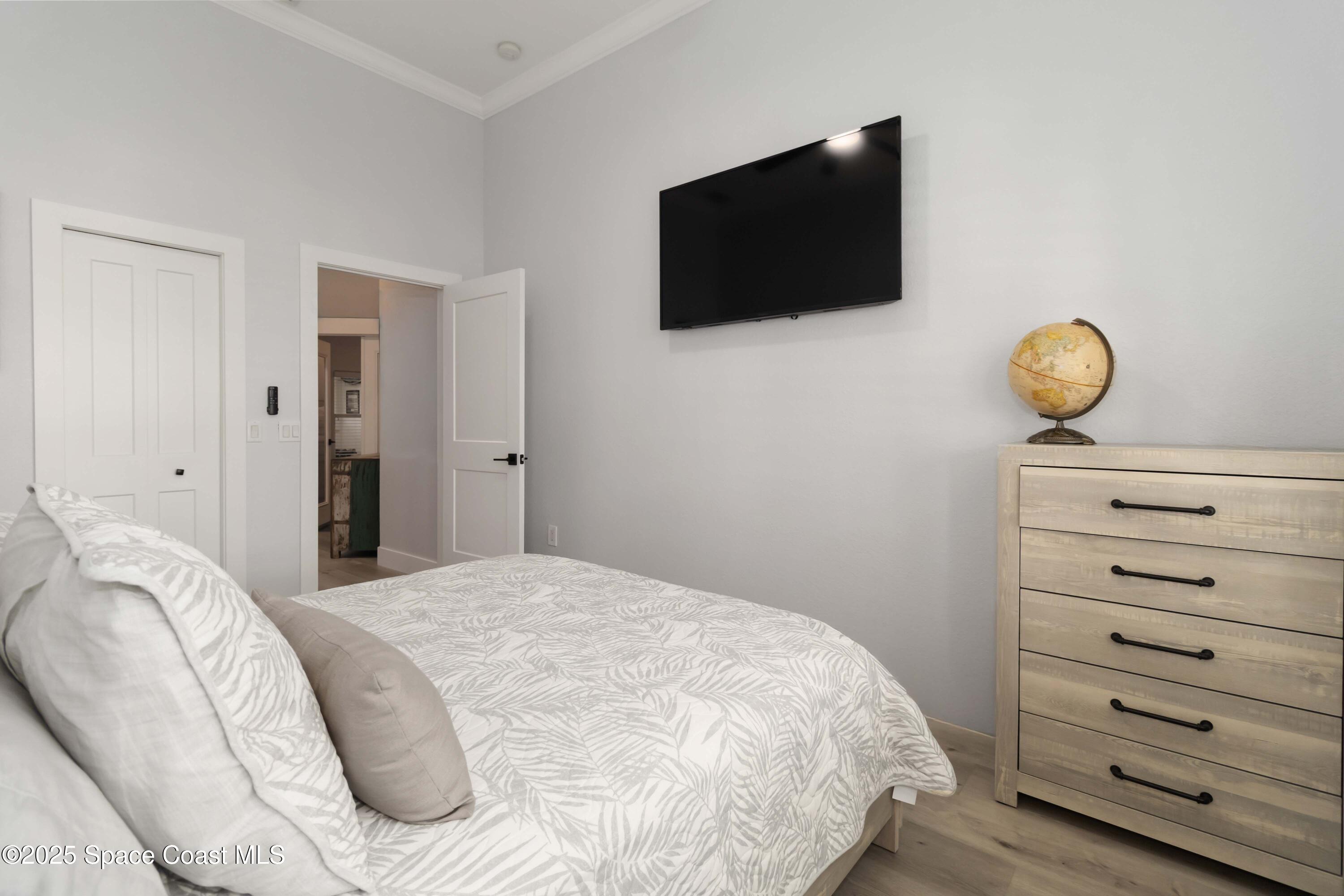 341 Buckskin Street Palm Bay, FL 32909 - Photo 40 of 69 a bedroom with a bed and a flat screen tv