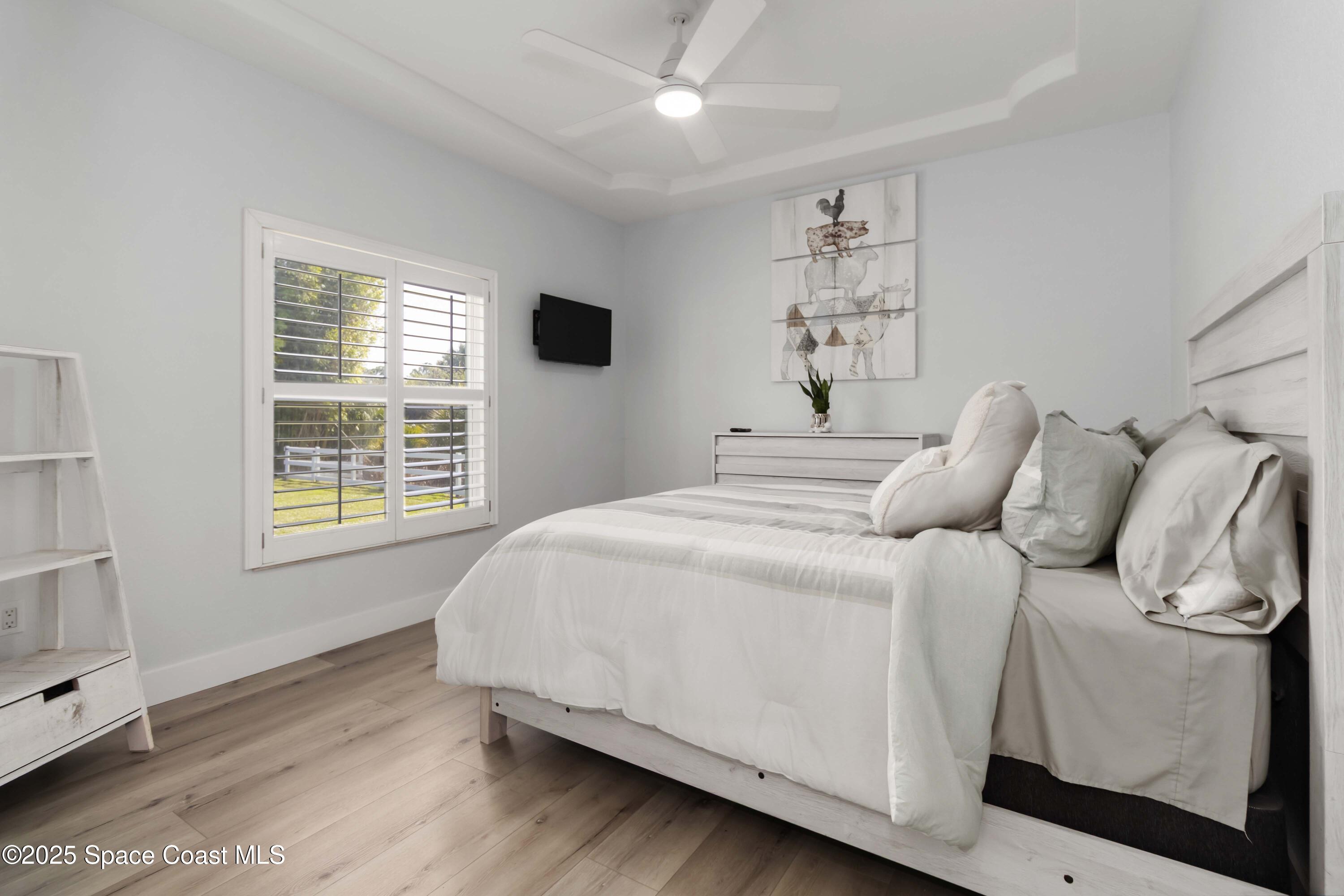 341 Buckskin Street Palm Bay, FL 32909 - Photo 43 of 69 a bedroom with a large bed and a window